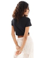 cropped baby tee with flower cut out in black