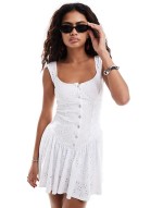 pearl button through broderie mini dress in white